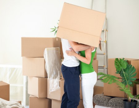 Organised storage unit with boxes and household items